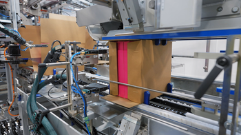 Integration with wrap around case packer